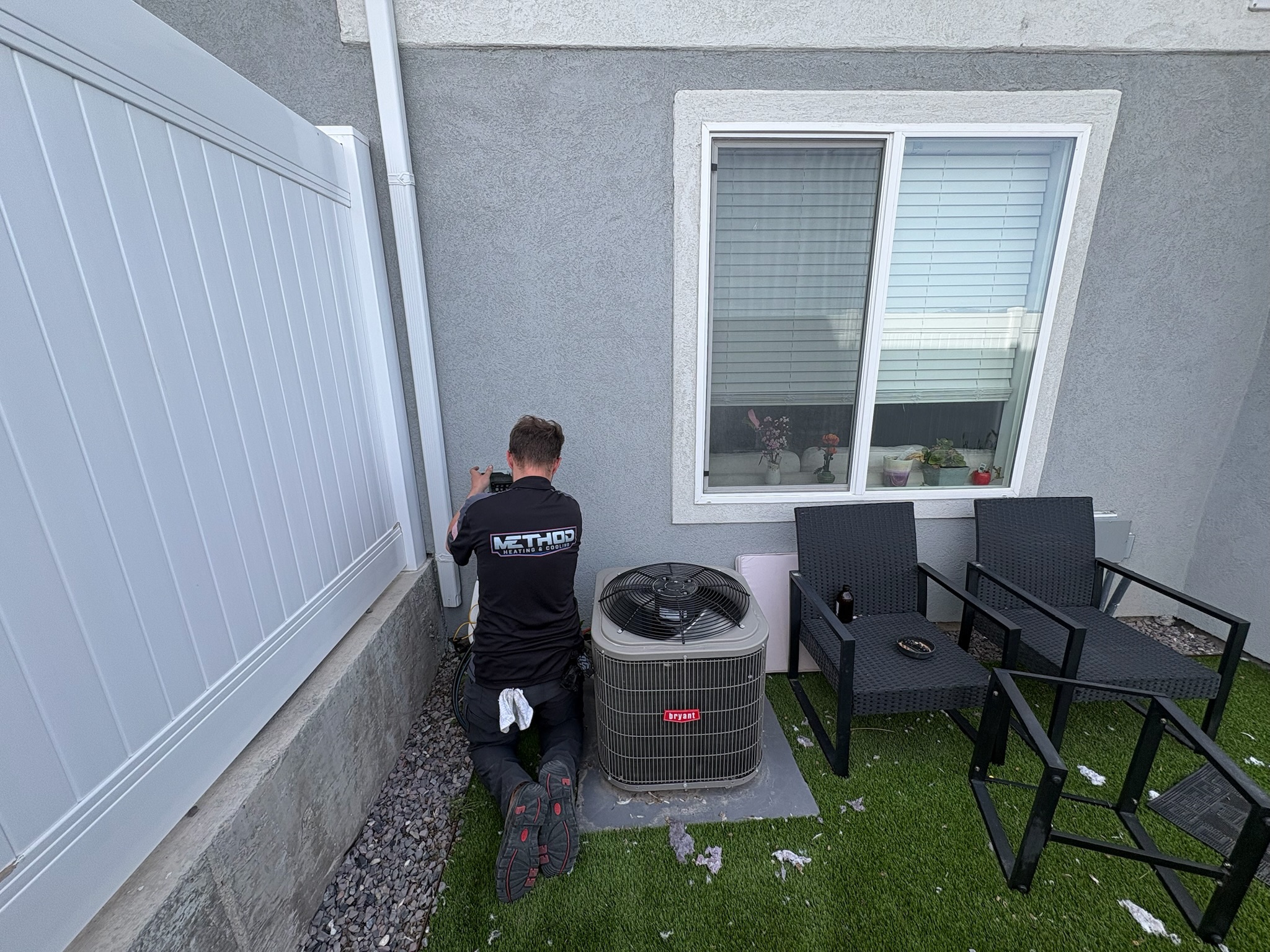 HVAC technician performing an AC tune up in Bluffdale, UT