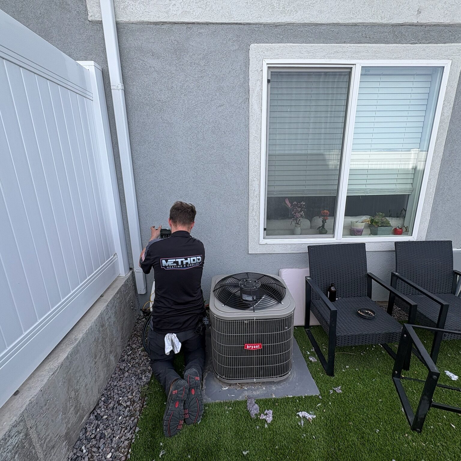 HVAC technician performing an AC tune up in Bluffdale, UT