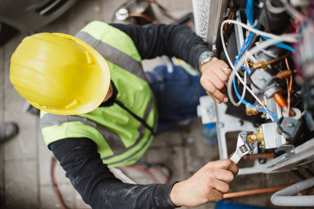 Air conditioning compressor being repaired by an experienced HVAC technician