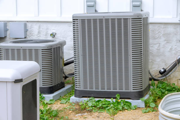 HVAC technician performing professional AC tune up in Sandy UT